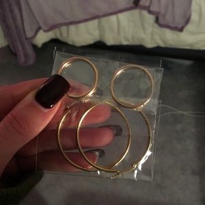 Two Sets of gold hoop earrings